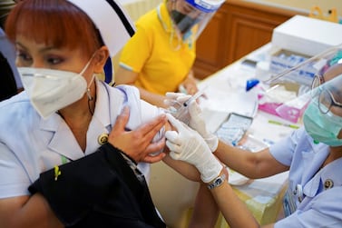 A health worker in Thailand receives a shot of the Sinovac vaccine. Reuters