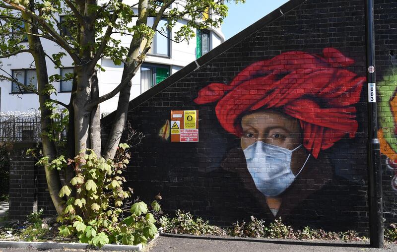 epa08371899 A mural by street artist Lionel Stanhope depicting a painting by Flemish master, Jan van Eyck wearing a protective face mask, is seen in Ladywell, South London, Britain, 19 April 2020. British Prime Minister Johnson has announced that Britons can only leave their homes for essential reasons or may be fined, in order to reduce the spread of the SARS-CoV-2 coronavirus which causes the COVID-19 disease.  EPA/FACUNDO ARRIZABALAGA