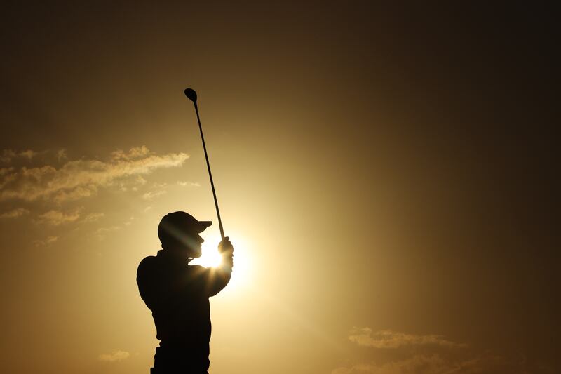 Danish golfer Rasmus Hojgaard is silhouetted against a low sun as he plays a shot during day two of the Abu Dhabi HSBC Championship, at Yas Links Golf Course in Abu Dhabi. He finished the round two under par. Getty Images