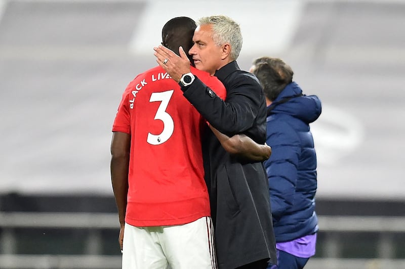 Tottenham Hotspur's Portuguese head coach Jose Mourinho (R) speaks with Manchester United's Ivorian defender Eric Bailly on the pitch after the English Premier League football match between Tottenham Hotspur and Manchester United at Tottenham Hotspur Stadium in London, on June 19, 2020. - The match ended 1-1. (Photo by Glyn KIRK / POOL / AFP) / RESTRICTED TO EDITORIAL USE. No use with unauthorized audio, video, data, fixture lists, club/league logos or 'live' services. Online in-match use limited to 120 images. An additional 40 images may be used in extra time. No video emulation. Social media in-match use limited to 120 images. An additional 40 images may be used in extra time. No use in betting publications, games or single club/league/player publications. / 