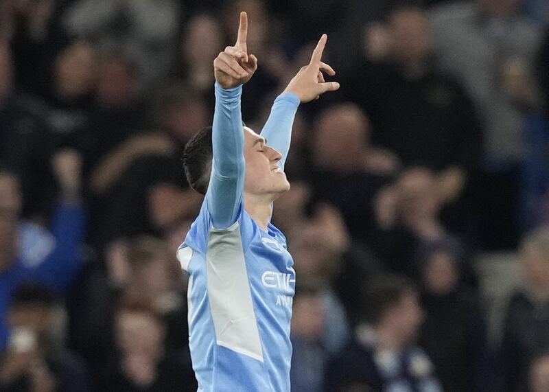 Phil Foden celebrates after scoring the second goal. EPA