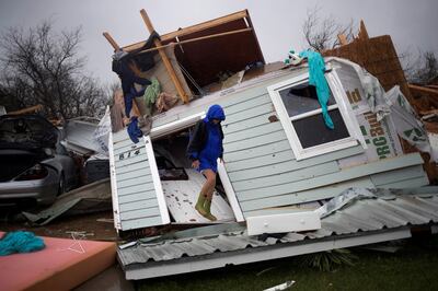 Barbara Koster stands on her front door as she surveys her property which was left devastated by Hurricane Harvey in Rockport, Texas, U.S. August 26, 2017. REUTERS/Adrees Latif     TPX IMAGES OF THE DAY