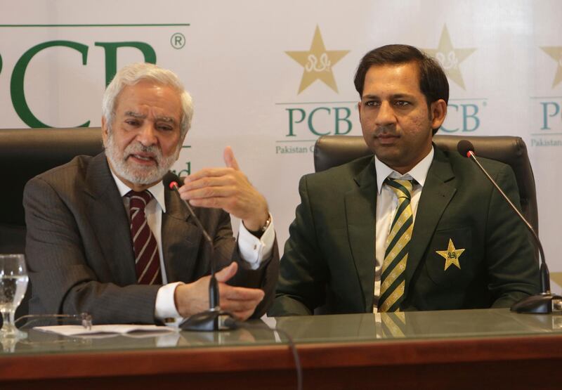 Chairman Pakistan Cricket Board Ehsan Mani, left, addresses a news conference with Sarfraz Ahmed in Lahore, Pakistan, Tuesday, Feb. 5, 2019. The PCB on Tuesday confirmed Ahmed as captain of the national team to the Cricket World Cup in England.  (AP Photo/K.M. Chaudary)