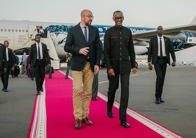 Rwanda's President Paul Kagame (R) welcomes Belgium's Prime Minister Charles Michel  who will attend the 25th Commemoration of the 1994 Genocide against the Tutsi, on April 6, 2019 at Kigali international airport in Kigali. / AFP / Cyril NDEGEYA
