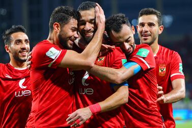 Ahly's midfielder Amr el-Solia (C) celebrates with his team after scoring the fourth goal during the FIFA Club World Cup third place football match between Egypt's Al-Ahly and Saudi's Al-Hilal at al-Nahyan Stadium in Abu Dhabi, on February 12, 2022. (Photo by Giuseppe CACACE / AFP)