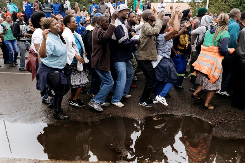 Employees and contractors of the Optimum Coal Mine in Hendrina, owned by the controversial Gupta family, demonstrate in front of the gates of the mine in Hendrina, South Africa, in 2018. AFP