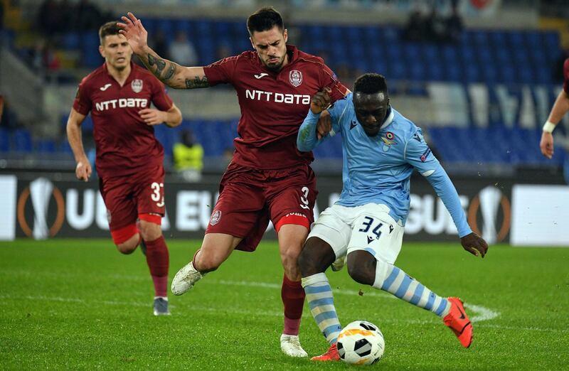 ROME, ITALY - NOVEMBER 28:  Bobby Adekanye of SS Lazio compete for the ball with Andrei Burca of CFR Cluj during the UEFA Europa League group E match between Lazio Roma and CFR Cluj at Stadio Olimpico on November 28, 2019 in Rome, Italy.  (Photo by Marco Rosi/Getty Images)
