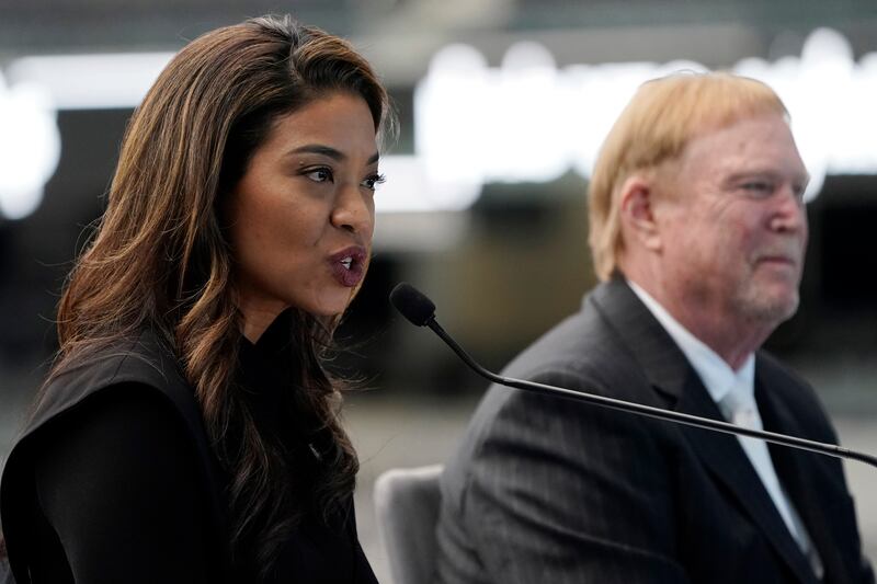 Ms Morgan alongside Las Vegas Raiders owner Mark Davis at the announcement of her appointment. AP