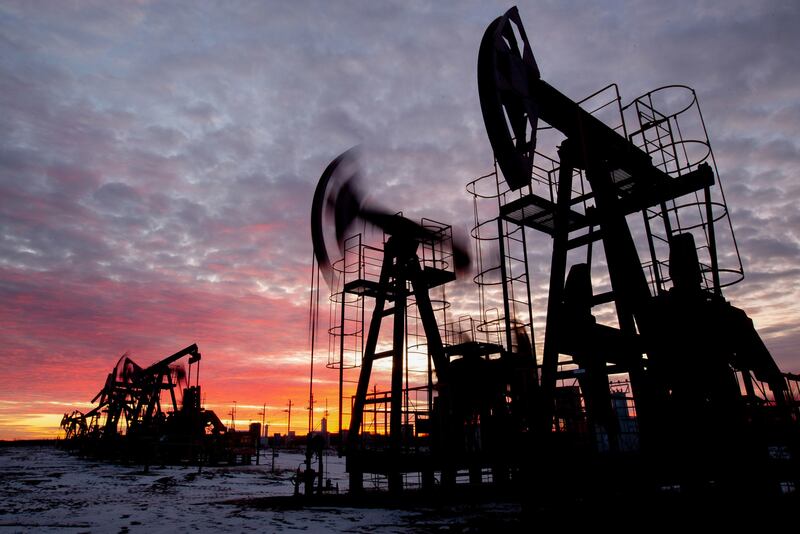 Oil pumping jacks in an oil field. Crude prices have rallied more than 70 per cent since last year. Bloomberg
