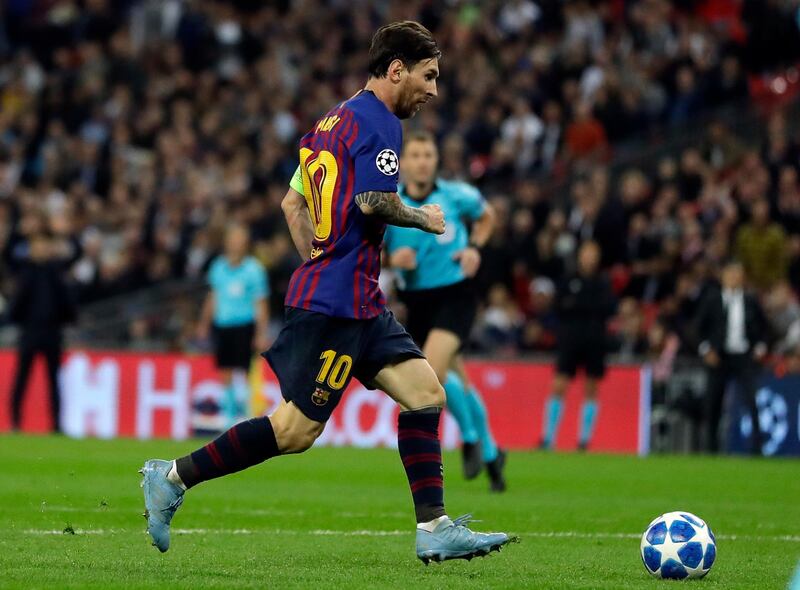 Barcelona forward Lionel Messi scores his side's fourth goal during the Champions League Group B soccer match between Tottenham Hotspur and Barcelona at Wembley Stadium in London, Wednesday, Oct. 3, 2018. (AP Photo/Kirsty Wigglesworth)