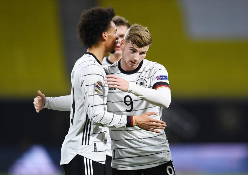 Leroy Sane celebrates with Timo Werner after scoring Germany's first goal in their 3-1 win against Ukraine on Saturday, November 14. Reuters