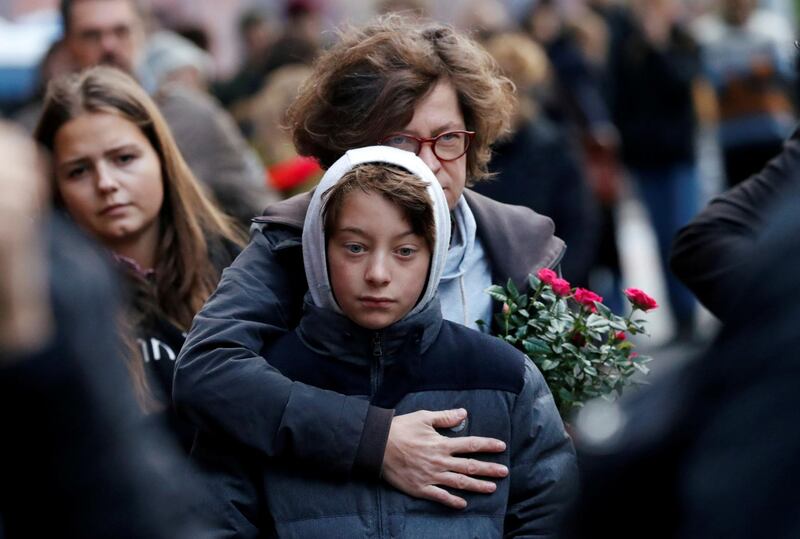 People mourn outside the synagogue in Halle, Germany after two people were killed in a shooting. Reuters
