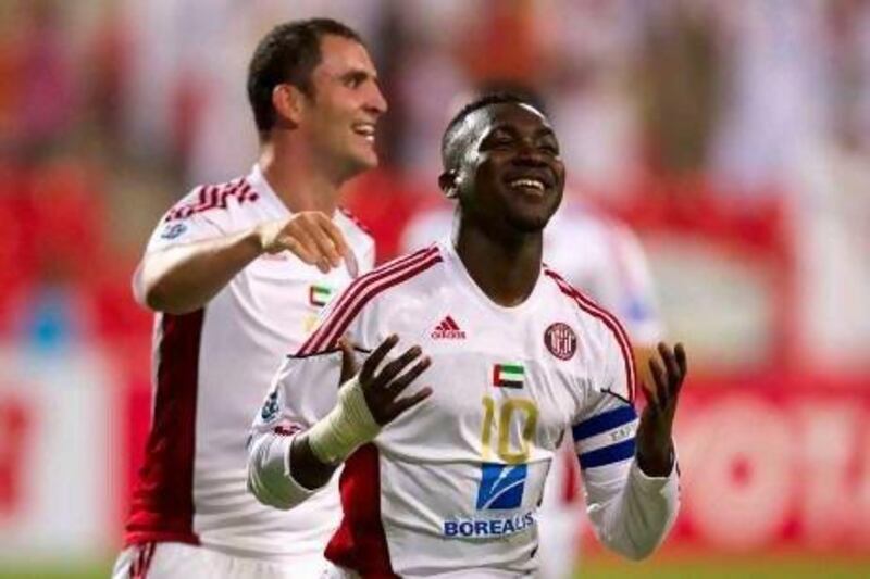 Al Jazira’s Ibrahim Diaky, right, celebrates his goal against Al Rayyan during an Asian Champions League win on Tuesday.