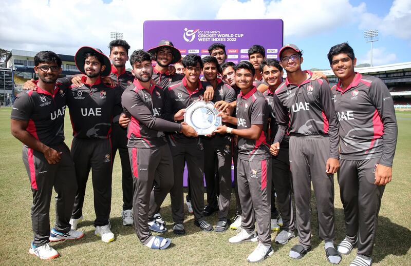 UAE players hold the trophy after beating Ireland by eight wickets to win the U19 World Cup Plate final on January 31, 2022 at Queen's Park Oval. Photo: ICC