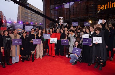 Mariette Rissenbeek, Kristen Stewart and Golshifteh Farahani, centre, were among activists attending a protest on the red carpet in solidarity with protesters in Iran. EPA