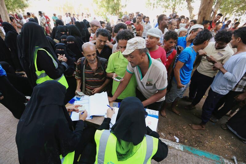 FILE PHOTO: People gather at a United Nations aid distribution center in Hodeidah, Yemen November 13, 2018.  Picture taken November 13, 2018. REUTERS/Abduljabbar Zeyad/File Photo