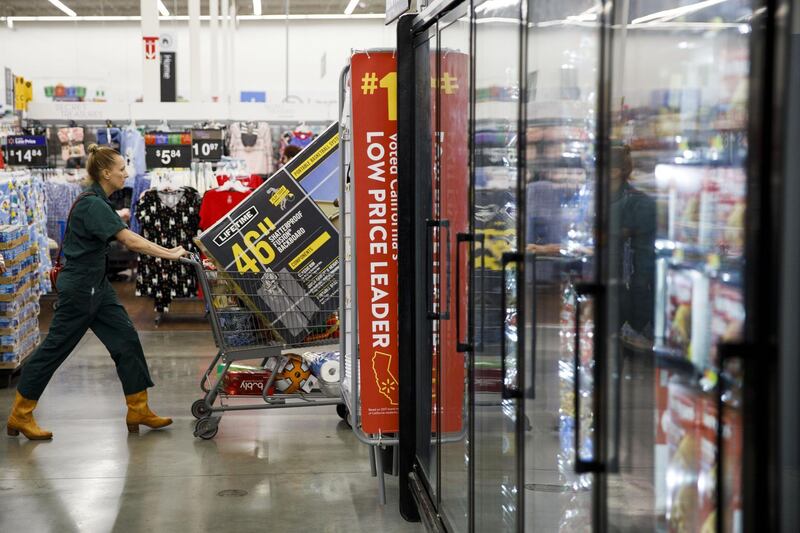 A customer pushes a full cart at a Walmart Inc. store in Burbank, California, U.S., on Monday, Nov. 19, 2018. To get the jump on Black Friday selling, retailers are launching Black Friday-like promotions in the weeks prior to the event since competition and price transparency are forcing retailers to grab as much share of the consumers' wallet as they can. Photographer: Patrick T. Fallon/Bloomberg