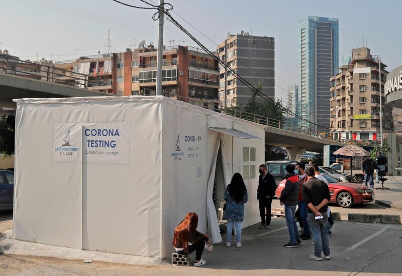 People line up to get tested for the coronavirus during a lockdown imposed by the authorities in a bid to slow the spread of the disease, in the town of Antelias, east of the Lebanese capital Beirut. AFP