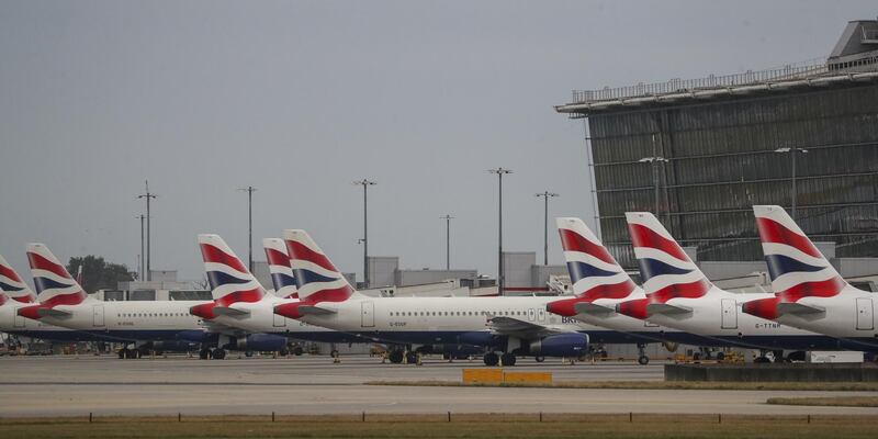 British Union flag logos sit on the tail fins of passenger aircraft, operated by British Airways, a unit of International Consolidated Airlines Group SA (IAG), at Terminal 5 at London Heathrow Airport in London, U.K., on Monday, Sept. 9, 2019. British Airways grounded most of its flights for the next two days as it faces its first strike by pilots in decades, a walkout that could cost the carrier 80 million pounds ($98 million). Photographer: Simon Dawson/Bloomberg