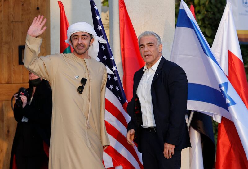 Sheikh Abdullah is welcomed to the Negev Summit by Mr Lapid.  AFP