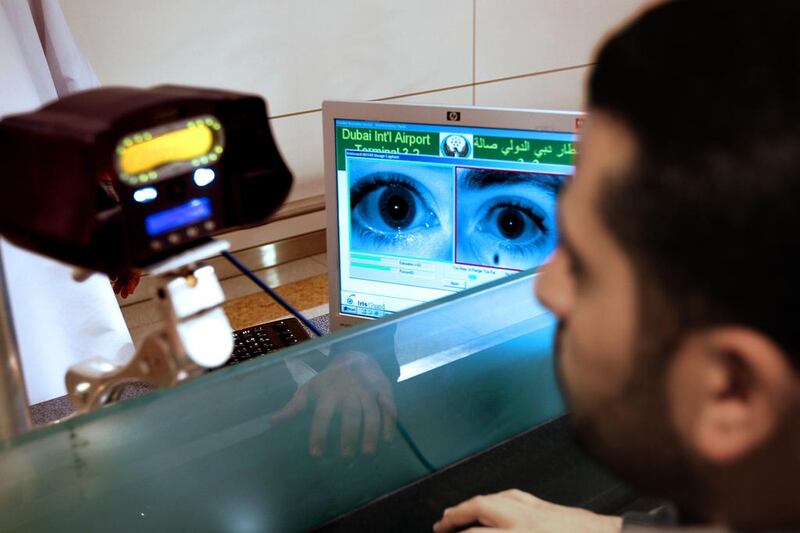 DNRD officials explain about eye-scan technology to an international delegation at Dubai International Airport Terminal 3. Pawan Singh / The National