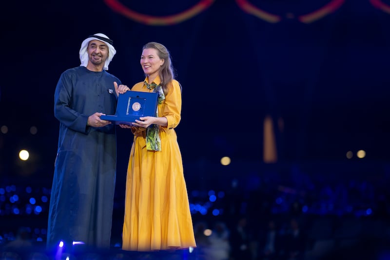 President Sheikh Mohamed presents an award to Caroline Slootweg from Kelp Blue. 