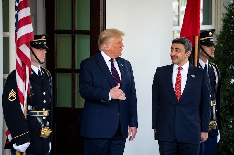 Sheikh Abdullah bin Zayed speaks to Mr Trump after arriving at the White House. Reuters