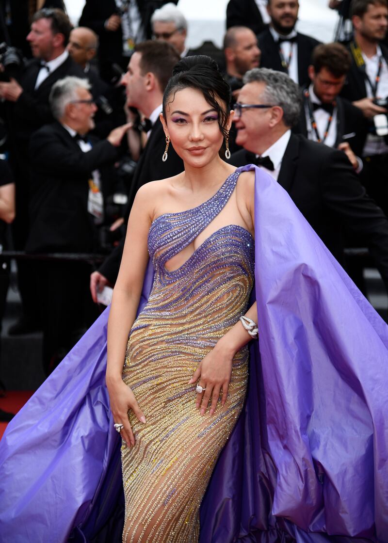 Chinese-American socialite Jessica Wang wears a purple and gold, caped Tony Ward to a screening of 'Forever Young (Les Amandiers)' on May 22. Getty Images