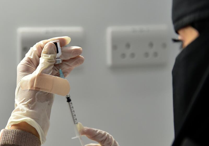 A nurse prepares a dose of Covid-19 vaccine at the Riyadh International Convention and Exhibition Centre in Saudi Arabia's capital city of Riyadh.  AFP