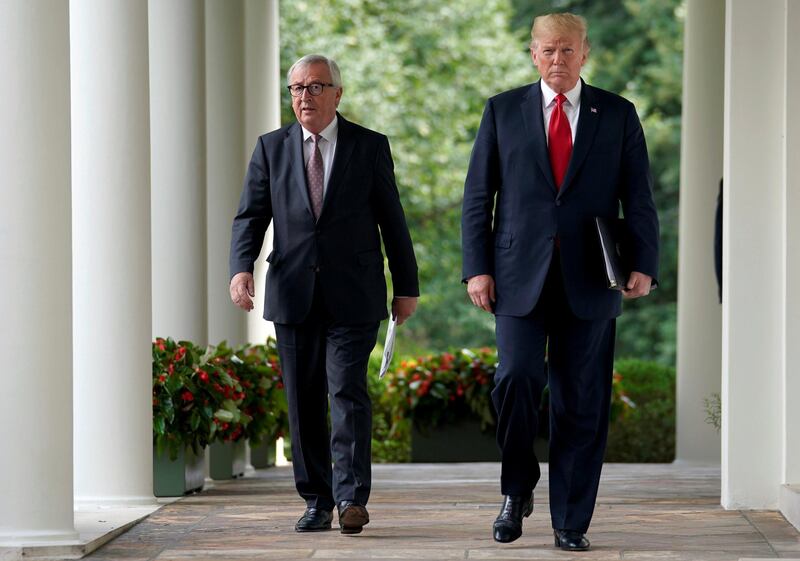 FILE PHOTO: U.S. President Donald Trump and President of the European Commission Jean-Claude Juncker walk together before speaking about trade relations in the Rose Garden of the White House in Washington, U.S., July 25, 2018. REUTERS/Joshua Roberts/File Photo
