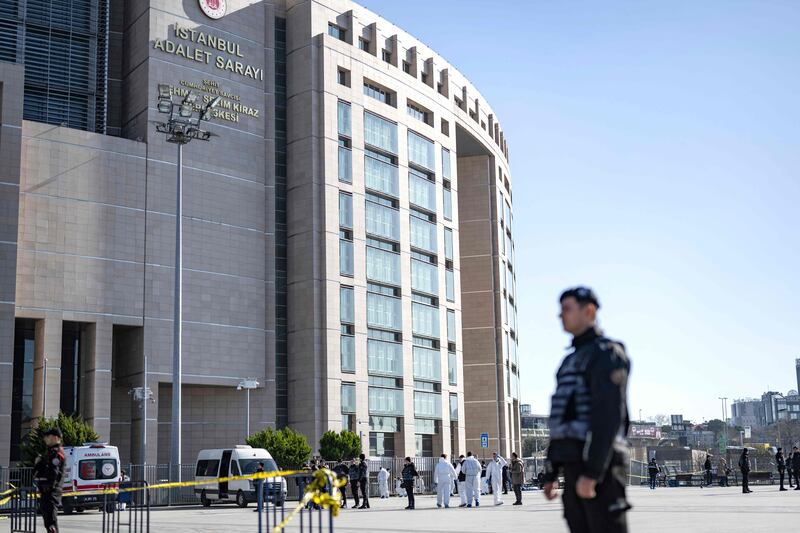A security cordon is set up around the Caglayan Court building in Istanbul, Turkey, as police forensics experts investigate after a shooting there on February 6. AFP