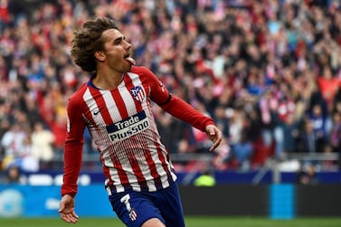 (FILES) In this file photo taken on February 9, 2019 Atletico Madrid's French forward Antoine Griezmann celebrates after scoring during the Spanish league football match Club Atletico de Madrid against Real Madrid CF at the Wanda Metropolitano stadium in Madrid. French striker Antoine Griezmann has told Atletico Madrid he will leave them in the close season, the Spanish club said on Twitter on May 14, 2019. The 28-year-old Griezmann has a contract until 2023 with Atletico, but has a buy out clause of 120million euros ($134million) and has been the target of several approaches from La Liga rivals Barcelona. / AFP / PIERRE-PHILIPPE MARCOU