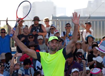 Croatia's Ivo Karlovic celebrates after winning over Japan's Yuichi Sugita during their second round match at the Australian Open tennis championships in Melbourne, Australia, Wednesday, Jan. 17, 2018. (AP Photo/Ng Han Guan)