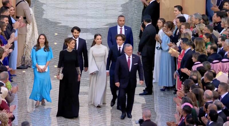 King Abdullah, Queen Rania, Prince Hashem, Princess Salma and Princess Iman arrive at Al Husseiniya Palace after the royal wedding. Reuters