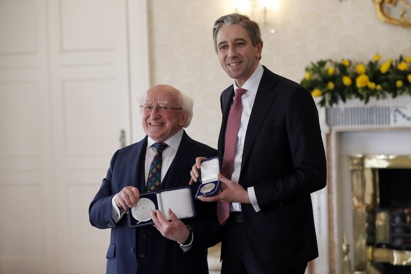 Mr Harris meets Irish President Michael D Higgins and receives the seal of office. PA