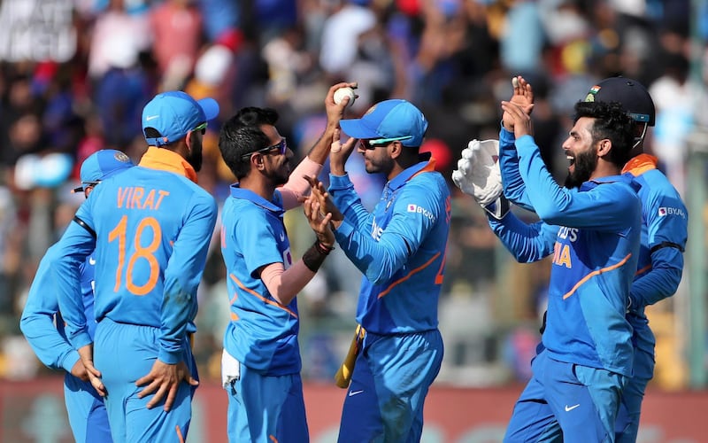 India bowler Ravindra Jadeja, right, celebrates the dismissal of Australia's Mitchell Starc. AP