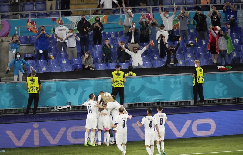 Italy players elebrate after scoring their second goal against Turkey. EPA