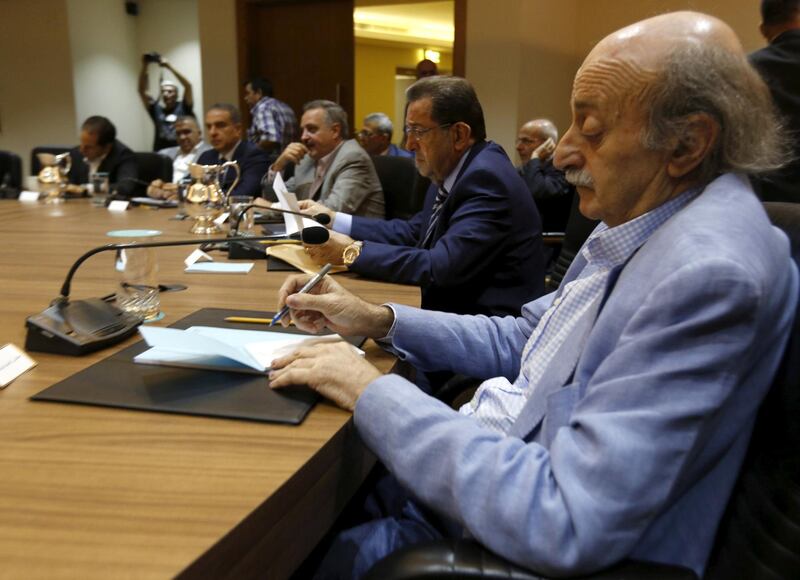 FILE PHOTO: Lebanon's Druze leader Walid Jumblatt (R) attends with other politicians a third session of the national dialogue talks aimed at discussing ways out of a political crisis, at the parliament building, in downtown Beirut, Lebanon September 22, 2015. REUTERS/Jamal Saidi/File Photo