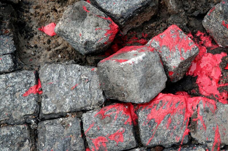 Cobblestones were thrown by masked protesters during clashes with French riot police. REUTERS/Philippe Wojazer
