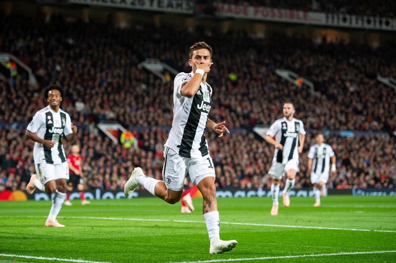 epa07114899 Juventus' Paulo Dybala celebrates scoring the opening goal during the UEFA Champions League Group H soccer match between Manchester United and Juventus held at Old Trafford in Manchester, Britain, 23 September 2018.  EPA/PETER POWELL