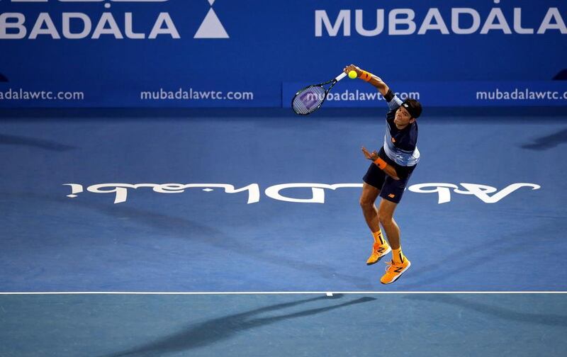 Milos Raonic unleashes one of his trademark serves against Rafael Nadal in the final of the Mubadala World Tennis Championship. Ali Haider / EPA