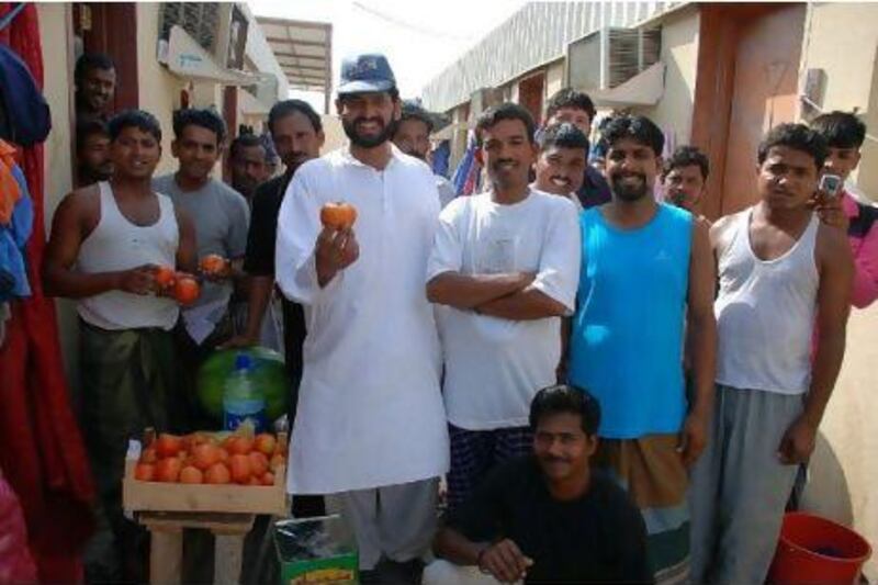 Men at an abandoned labour camp show their gratitude after receiving food donations from Adopt-A-Camp, which is gearing up for one of its busiest periods this year.