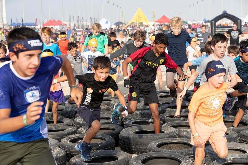 ABU DHABI, UNITED ARAB EMIRATES. 11 OCTOBER 2019. The Tough Mudder sports event held on Hudayriat Island in Abu Dhabi. Kids compete and enjoy the obstacles and challenges on the Mini Mudder course specially designed for children. (Photo: Antonie Robertson/The National) Journalist: None. Section: National.
