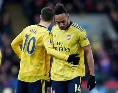 Soccer Football - Premier League - Crystal Palace v Arsenal - Selhurst Park, London, Britain - January 11, 2020  Arsenal's Pierre-Emerick Aubameyang is comforted by Mesut Ozil as he leaves the pitch after being shown a red card REUTERS/David Klein  EDITORIAL USE ONLY. No use with unauthorized audio, video, data, fixture lists, club/league logos or "live" services. Online in-match use limited to 75 images, no video emulation. No use in betting, games or single club/league/player publications.  Please contact your account representative for further details.