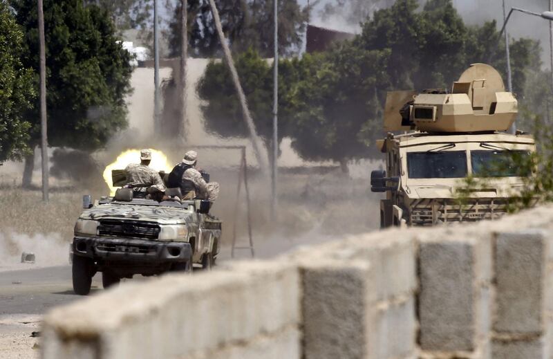 TOPSHOT - Fighters loyal to the internationally-recognised Government of National Accord (GNA) fire a jeep-mounted gun during clashes with forces loyal to strongman Khalifa Haftar, in Espiaa, about 40 kilometres (25 miles) south of the Libyan capital Tripoli on April 29, 2019.  Fierce fighting for control of Libya's capital that has already displaced tens of thousands of people threatens to bring a further worsening of humanitarian conditions, a senior UN official has warned. / AFP / Mahmud TURKIA
