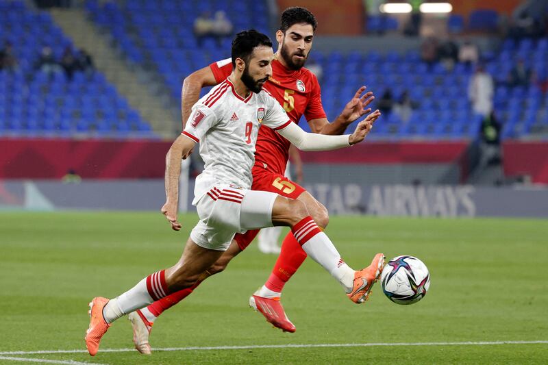 UAE midfielder Bandar Al Ahbabi is marked by Syria's defender Youssef Mohammad. AFP