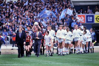 The Chelsea and Manchester City players enter the field for the 1986 Full Members Cup. Colorsport