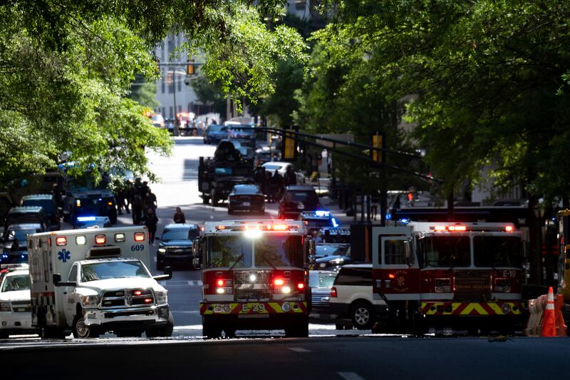 Police and emergency workers gather in Atlanta’s city center after reports of a shooting inside a medical building. AP