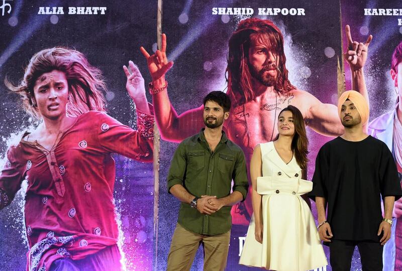 From left, Bollywood actors Shahid Kapoor, Alia Bhatt and Diljit Dosanjh attend a news conference for their upcoming film Udta Punjab in Mumbai on June 14, 2016. A top court told India's film censor board on June 13 not to act "like a grandmother" as it overturned a controversial demand by the notoriously strict body for 13 cuts to a film depicting drug addiction. PUNIT PARANJPE / AFP

