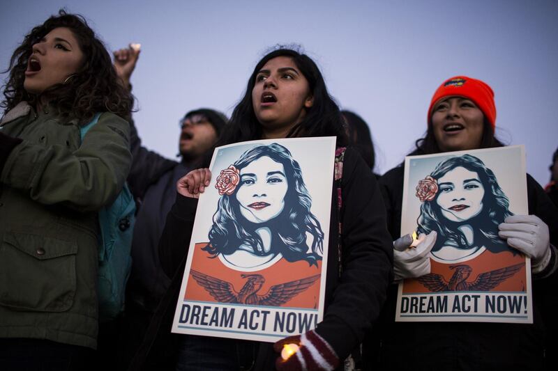 Demonstrators sing and hold signs during a rally supporting the Deferred Action for Childhood Arrivals program (DACA), or the Dream Act, outside the U.S. Capitol building in Washington, D.C., U.S., on Thursday, Jan. 18, 2018. The House passed a spending bill Thursday to avoid a U.S. government shutdown, but Senate Democrats say they have the votes to block the measure in a bid to force Republicans and President Donald Trump to include protection for young immigrants. Photographer: Zach Gibson/Bloomberg
